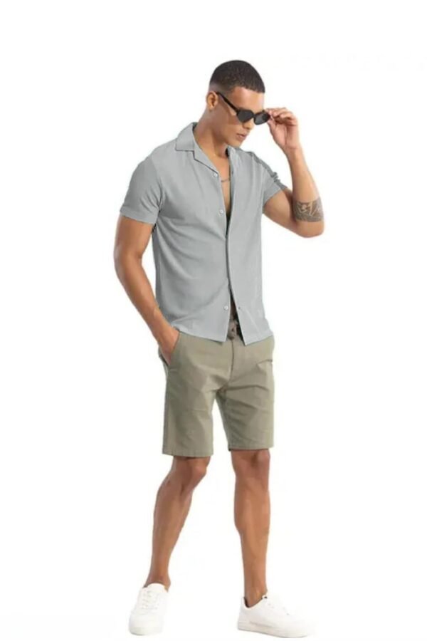 Navy blue solid self design opaque Casual shirt ,has a spread collar, button placket, na pocket, short regular sleeves, curved hem